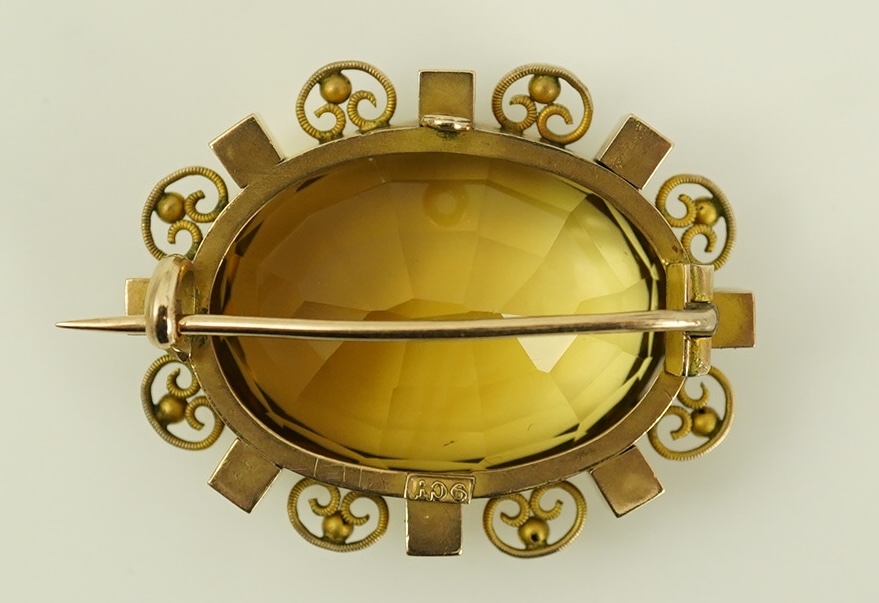 A late Victorian 9ct gold, citrine and seed pearl cluster set oval brooch